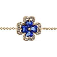 bracelet en plaqué or chaîne avec au milieu trèfle à 4 feuilles en oxydes bleus avec contours en oxydes blancs sertis - longueur 16cm + 2cm de rallonge