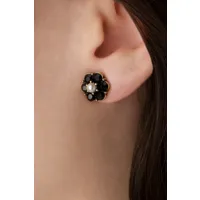 petites puces d'oreilles en forme de fleur serties de jais en noir